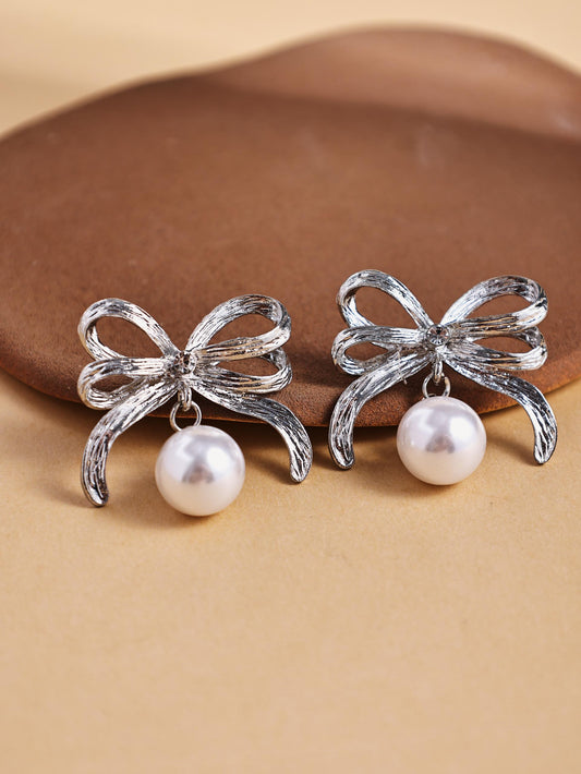 Pearl Bow Stud Earrings – Elegant Knot Metal Statement Jewelry