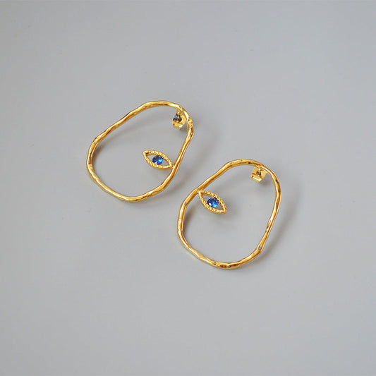 Gold Abstract Hoop Earrings with Blue Eye Detail