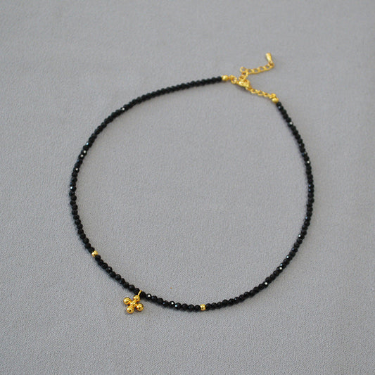 Black Beaded Necklace with Gold Flower Pendant