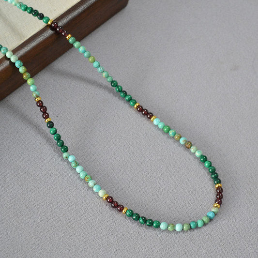 Green Beaded Necklace with Gold and Garnet Accents