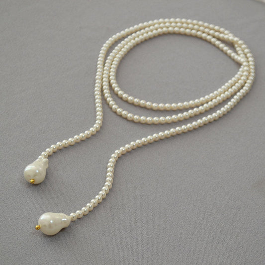 Elegant Long Pearl Necklace with Drop-Shaped Pearls